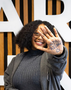 Student Ambassador with Girl Rising on hand