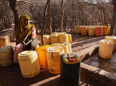 Girl with water jugs.jpg